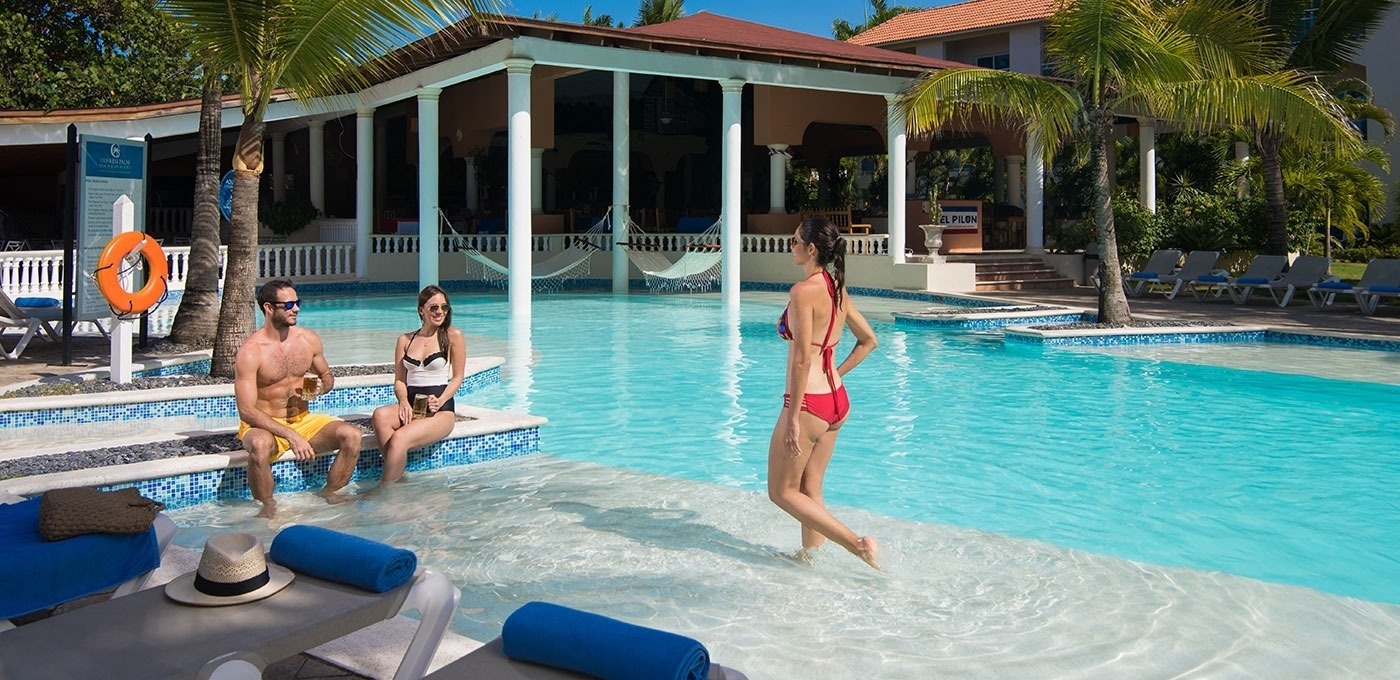 Main pool surrounded by palm trees