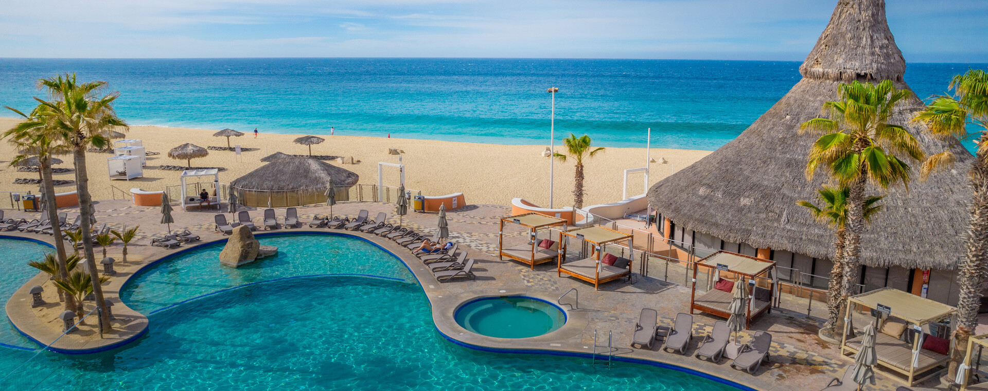 Beach aerial with clifftop resort