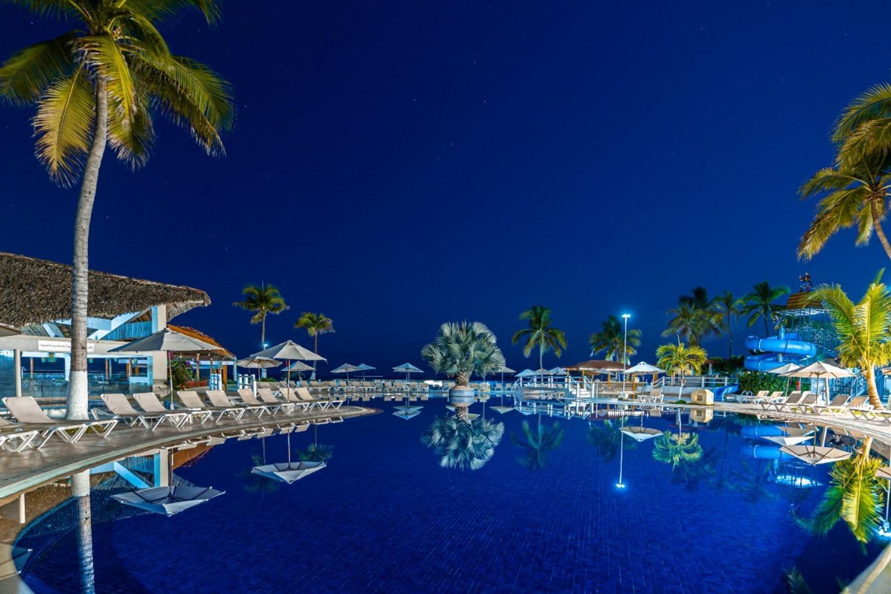 Resort pool illuminated at night